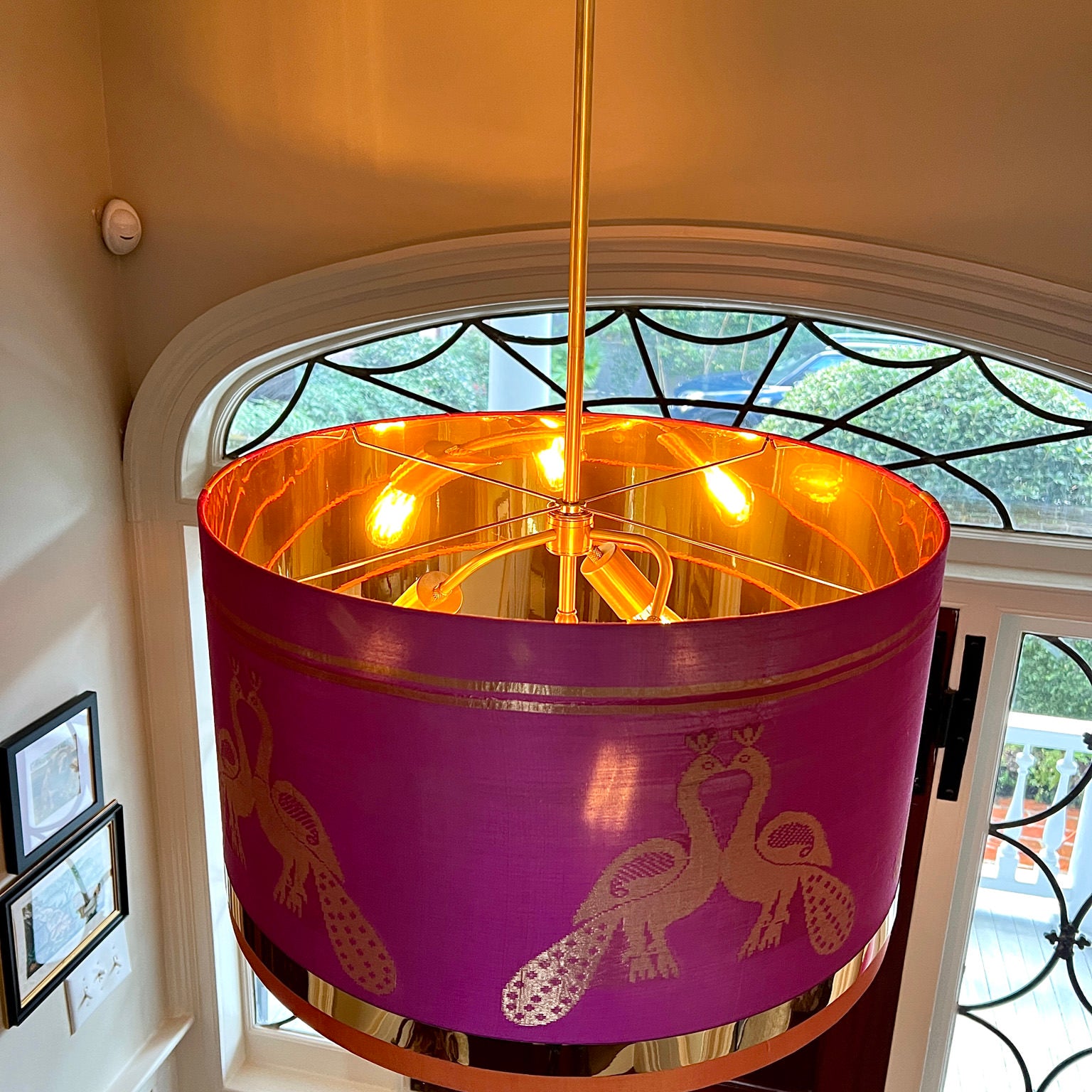 pink drumshade hung in foyer