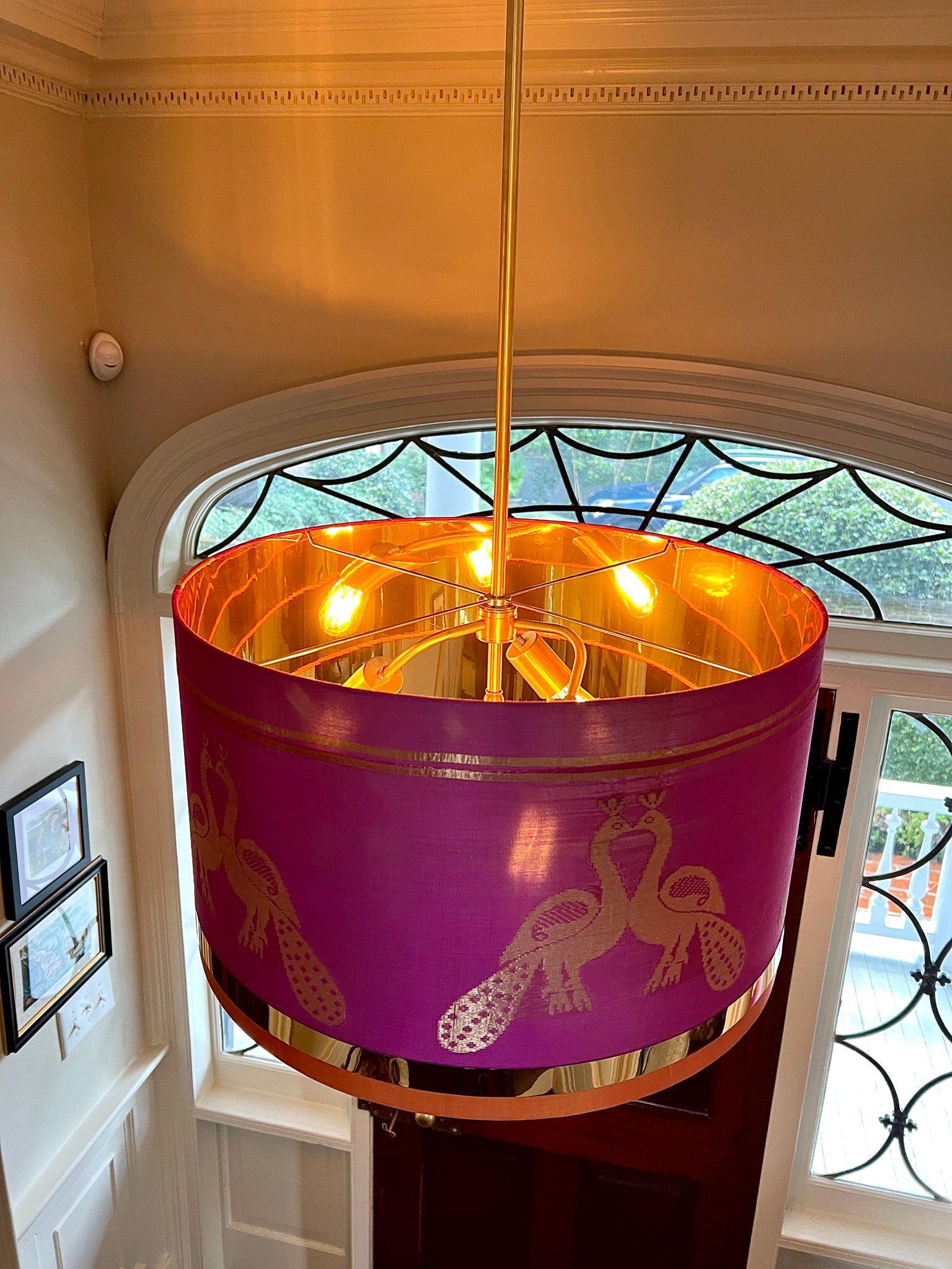 pink drumshade hung in foyer