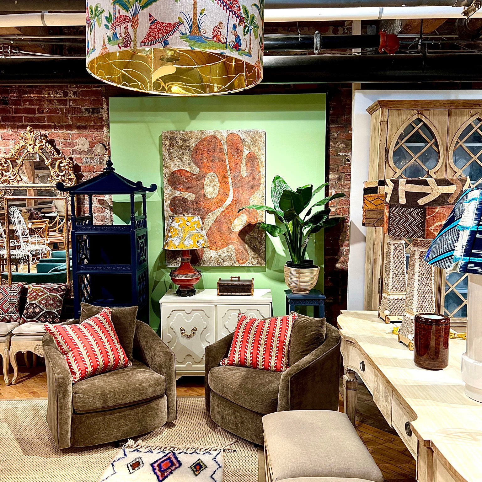 monkey fabric drum shade hung up in a furniture store