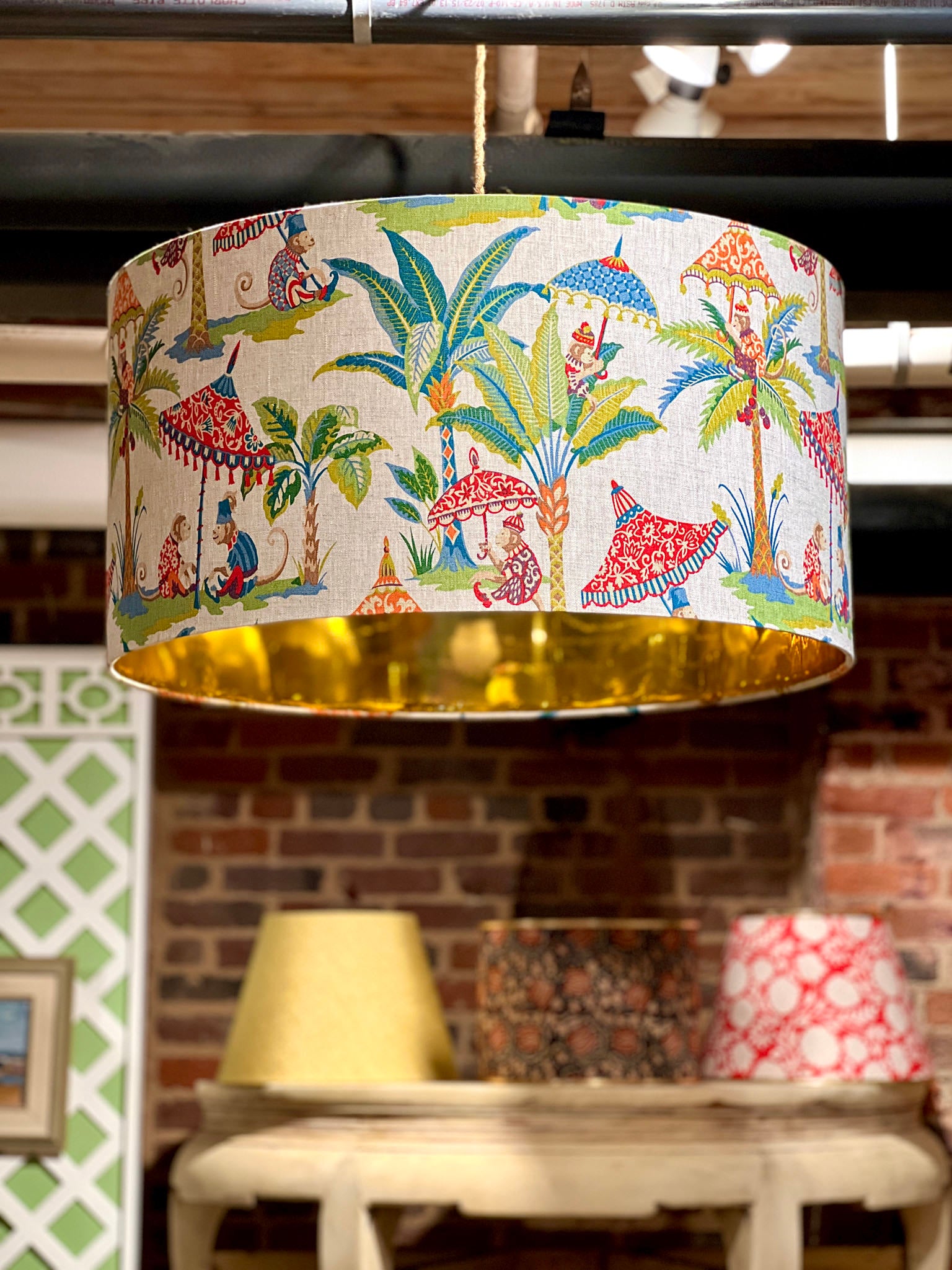 closeup of monkey fabric lampshade that's hung up
