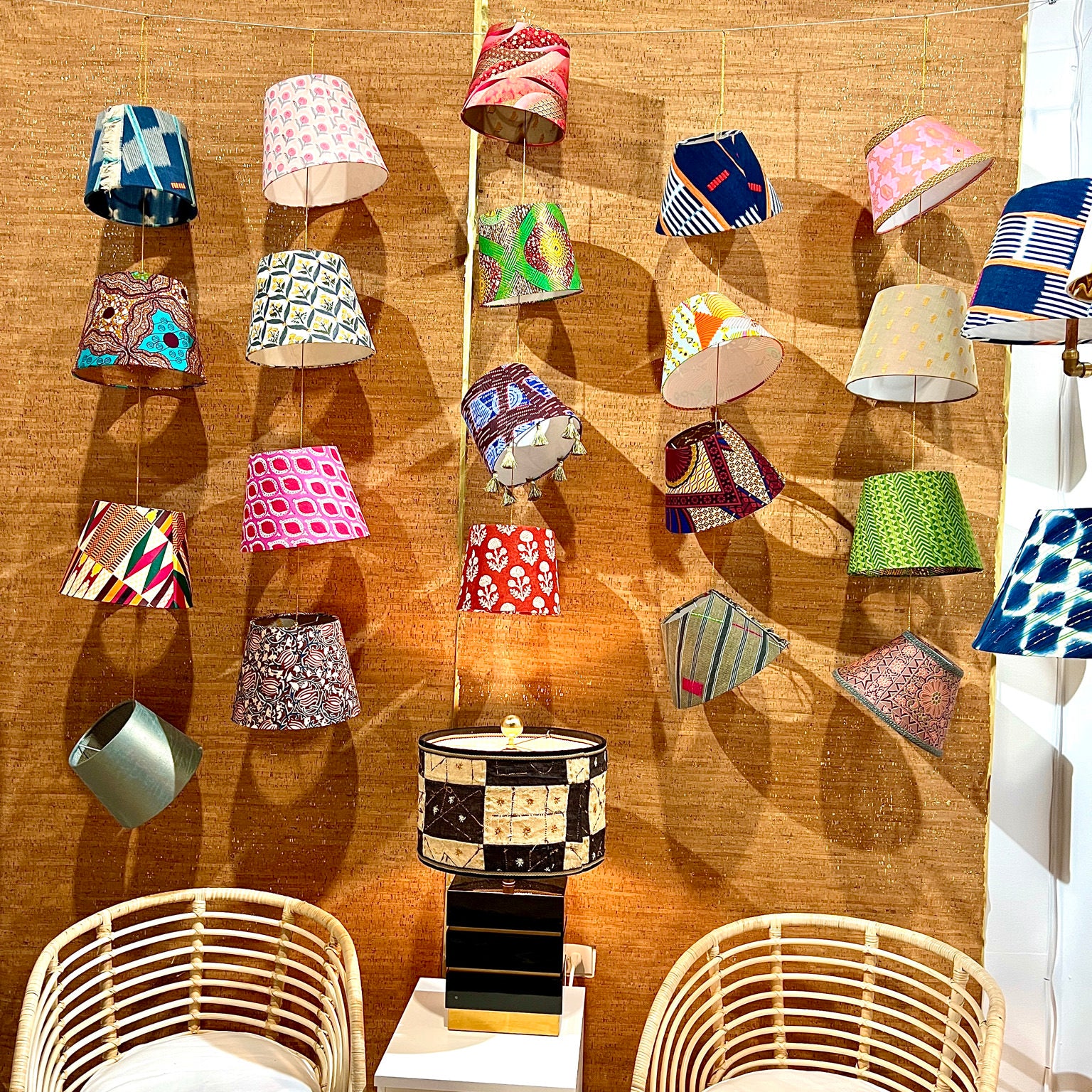 different design and colors of lampshades and two chairs