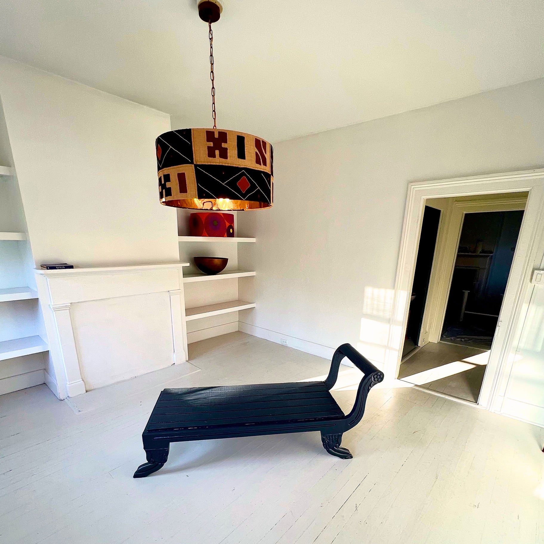 kuba cloth lampshade and black bench