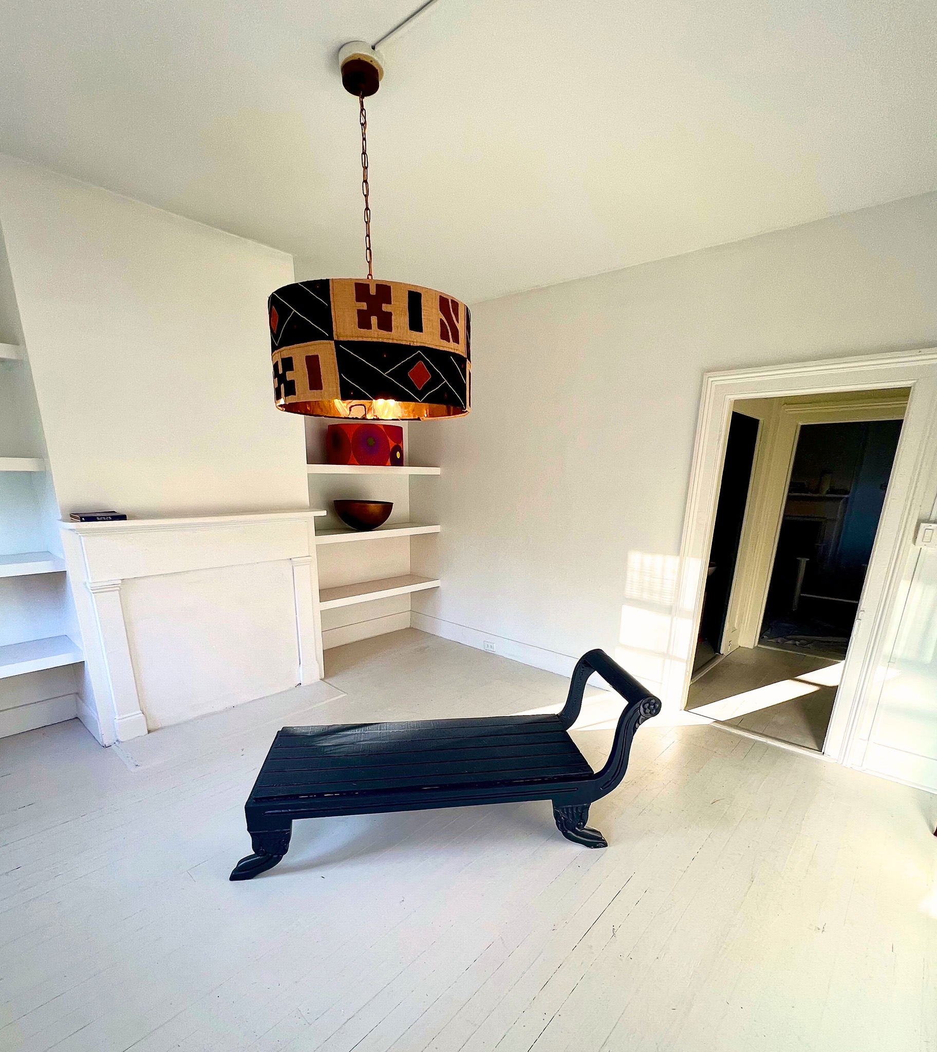 kuba cloth lampshade and black bench