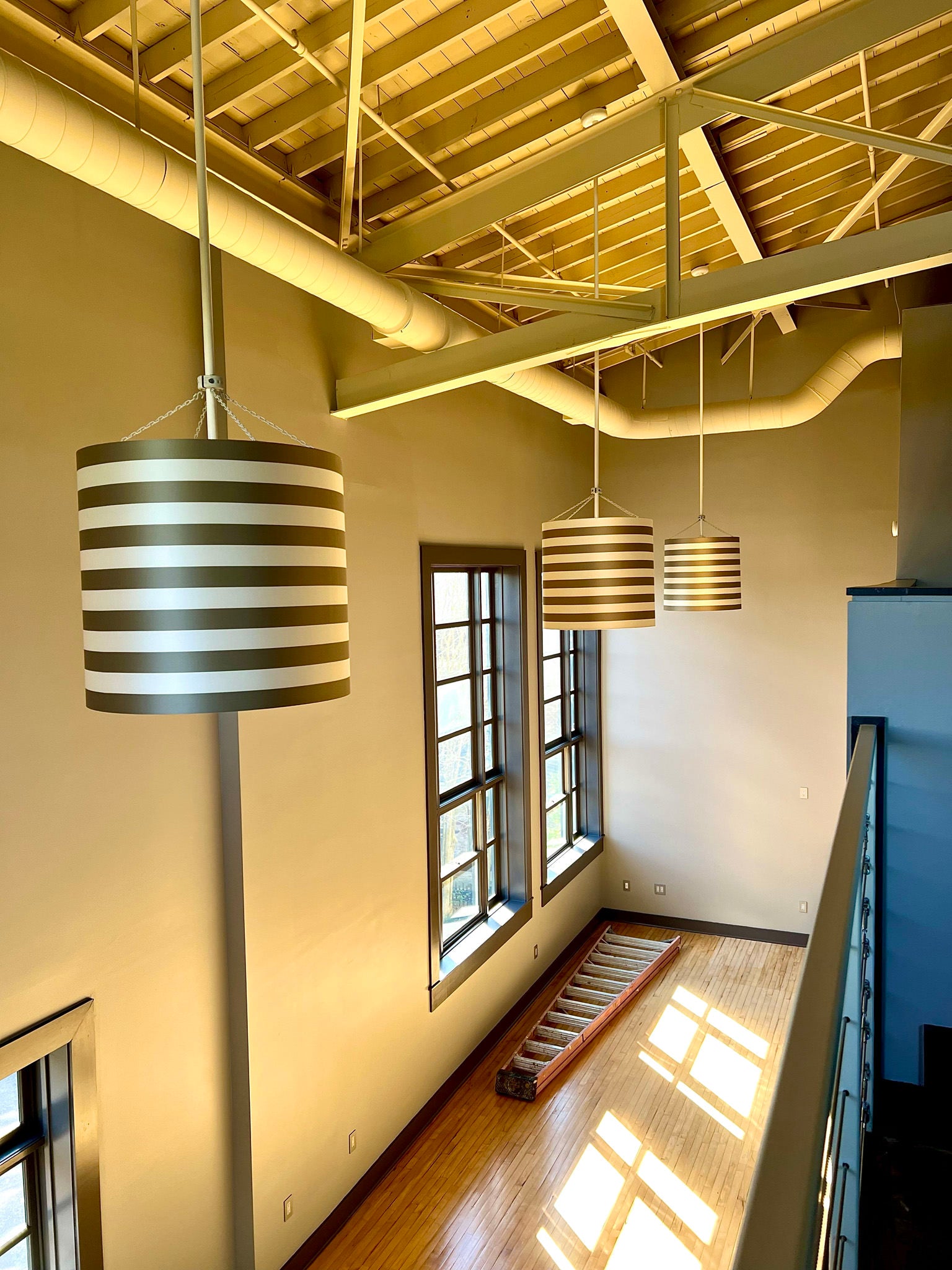 black and beige drum lighting hung