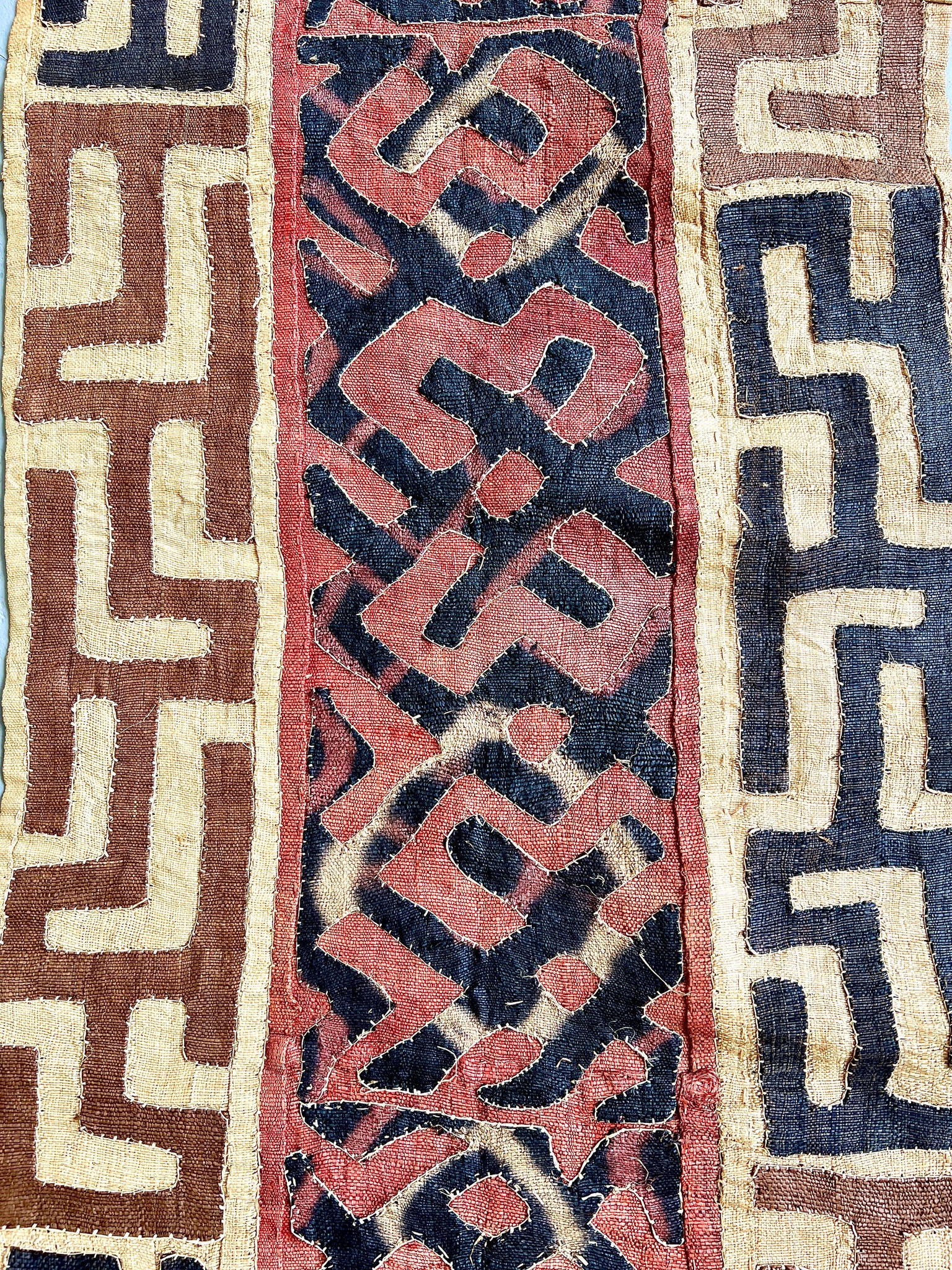 beige, brown, rust and black kuba cloth