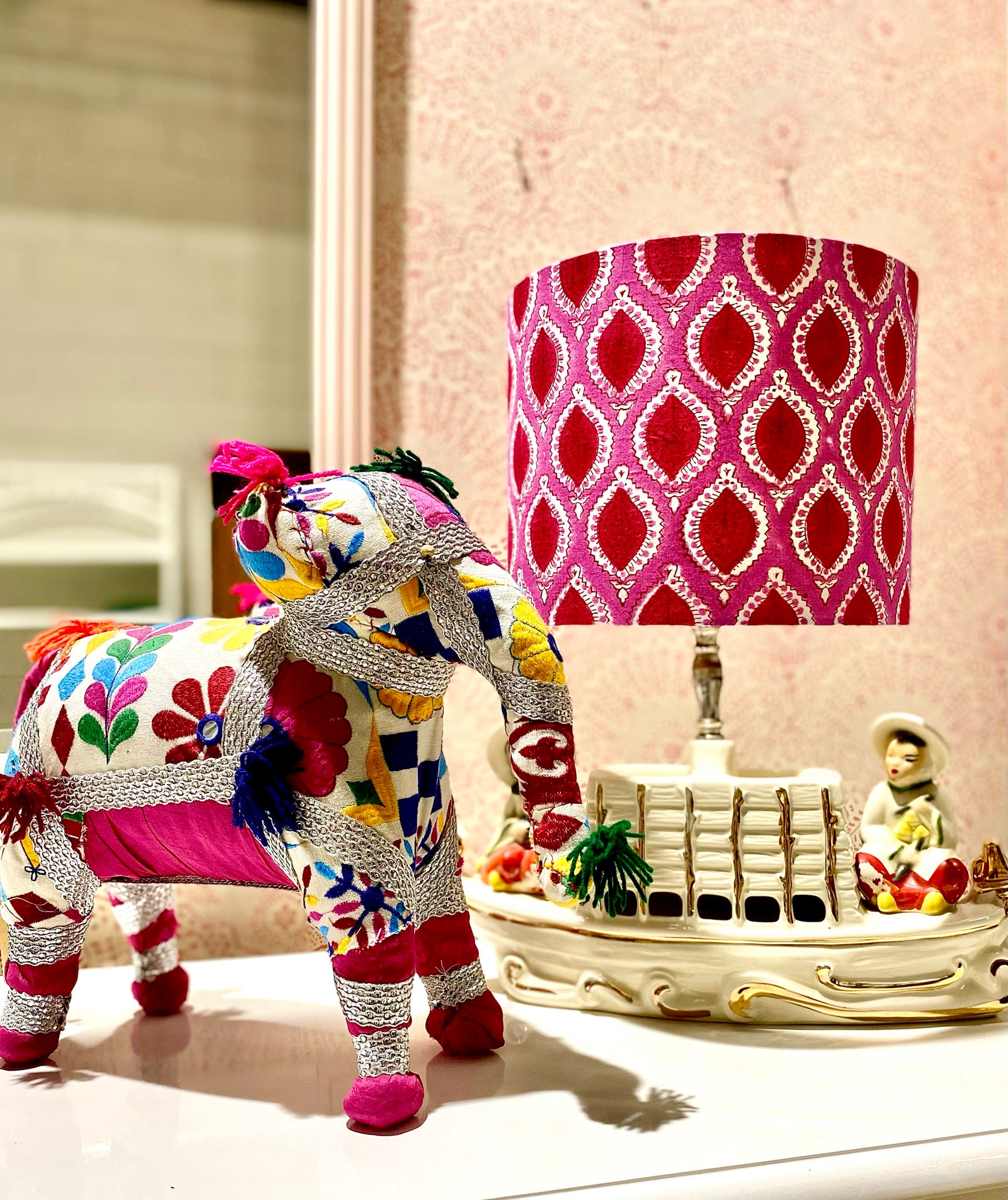 play elephant stuffed animal beside a lamp