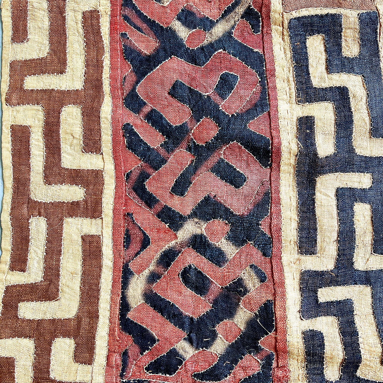 beige, brown, rust and black kuba cloth