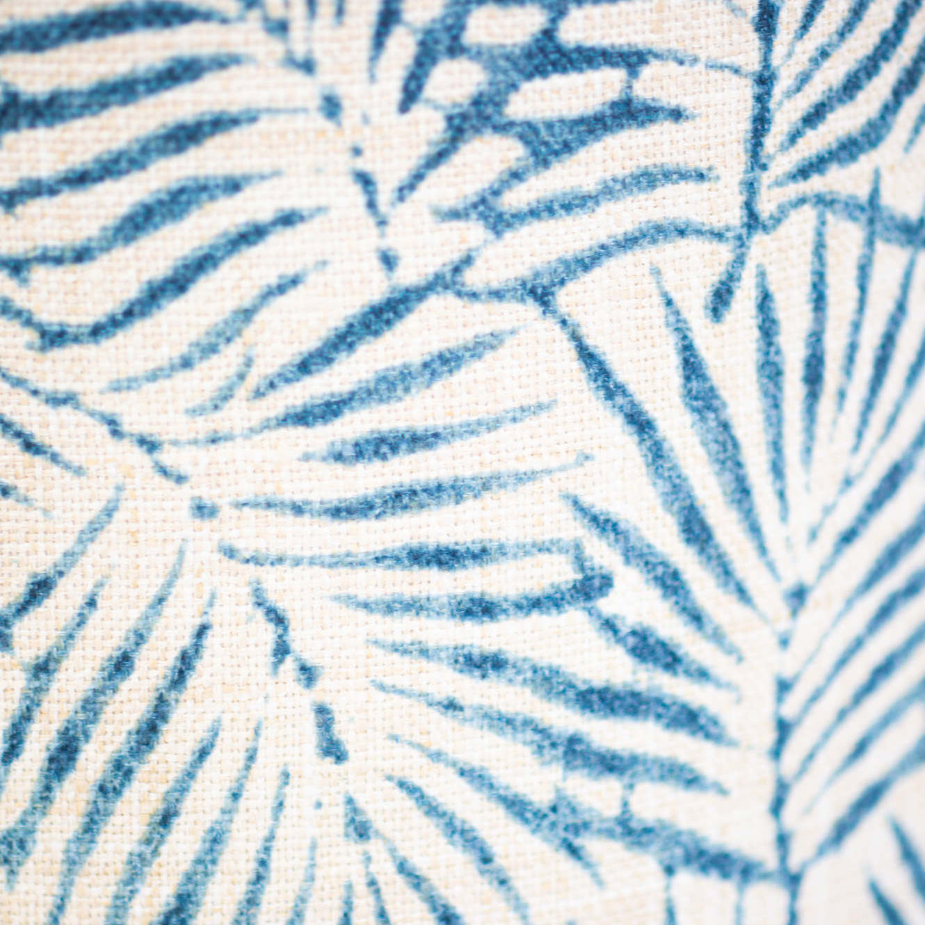 blue palm leaves on white fabric